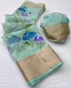 Sea green color organza silk saree with printed work