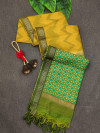 Yellow and green  color tussar silk saree with zari woven work