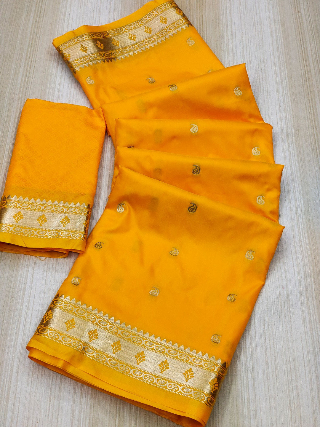 Yellow color paithani silk saree with zari weaving work