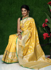 Yellow color lichi silk saree with silver zari weaving work