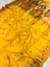 Mustard yellow color paithani silk saree with golden zari weaving work