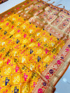 Yellow color patola silk saree with zari woven work