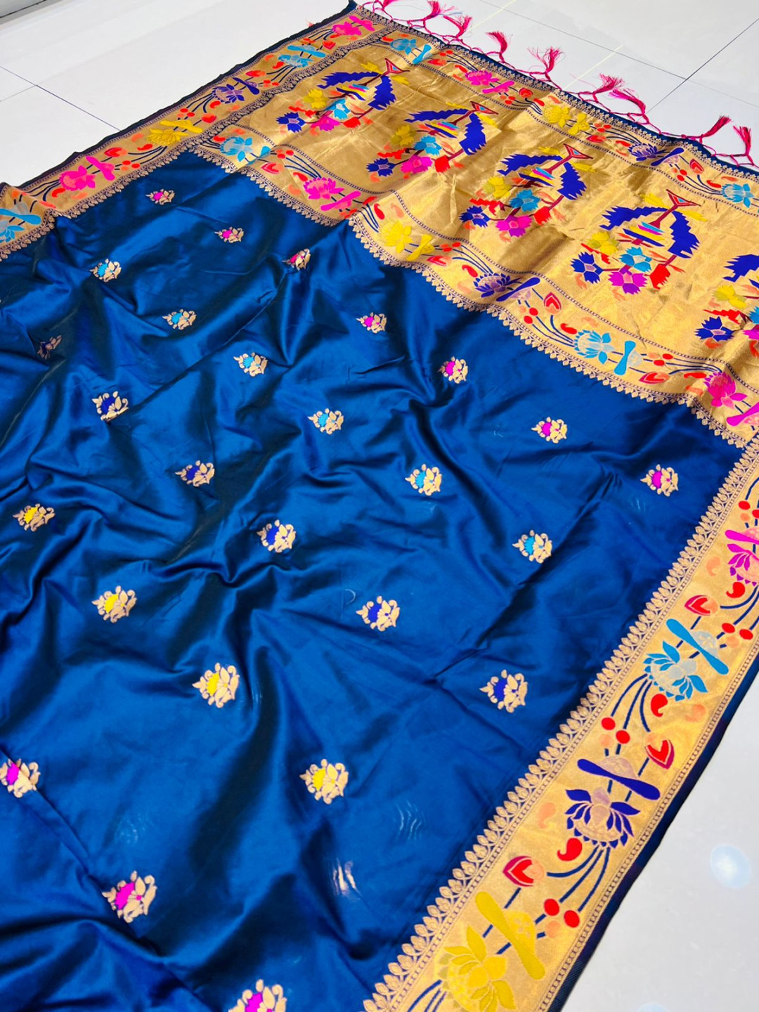Navy blue color paithani silk saree with golden zari weaving work