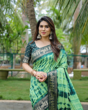 Parrot green color dola silk saree with zari weaving work