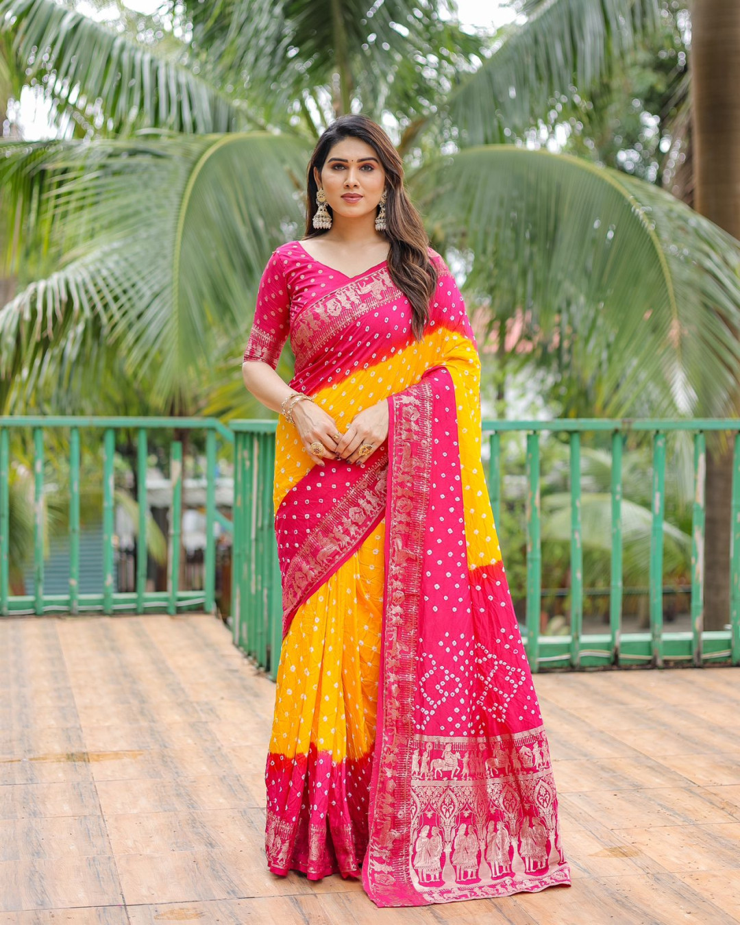 Yellow and pink color hand bandhej silk saree with zari weaving work