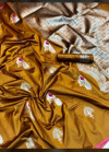 Mustard yellow color lichi silk saree with silver zari weaving heavy work