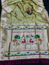Pista green color paithani silk saree with golden zari weaving work