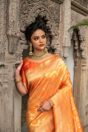 Featuring an orange organza saree paired with a chanderi silk blouse with  antique gold dori, aari and embellished hand work. Jewellery: ... |  Instagram