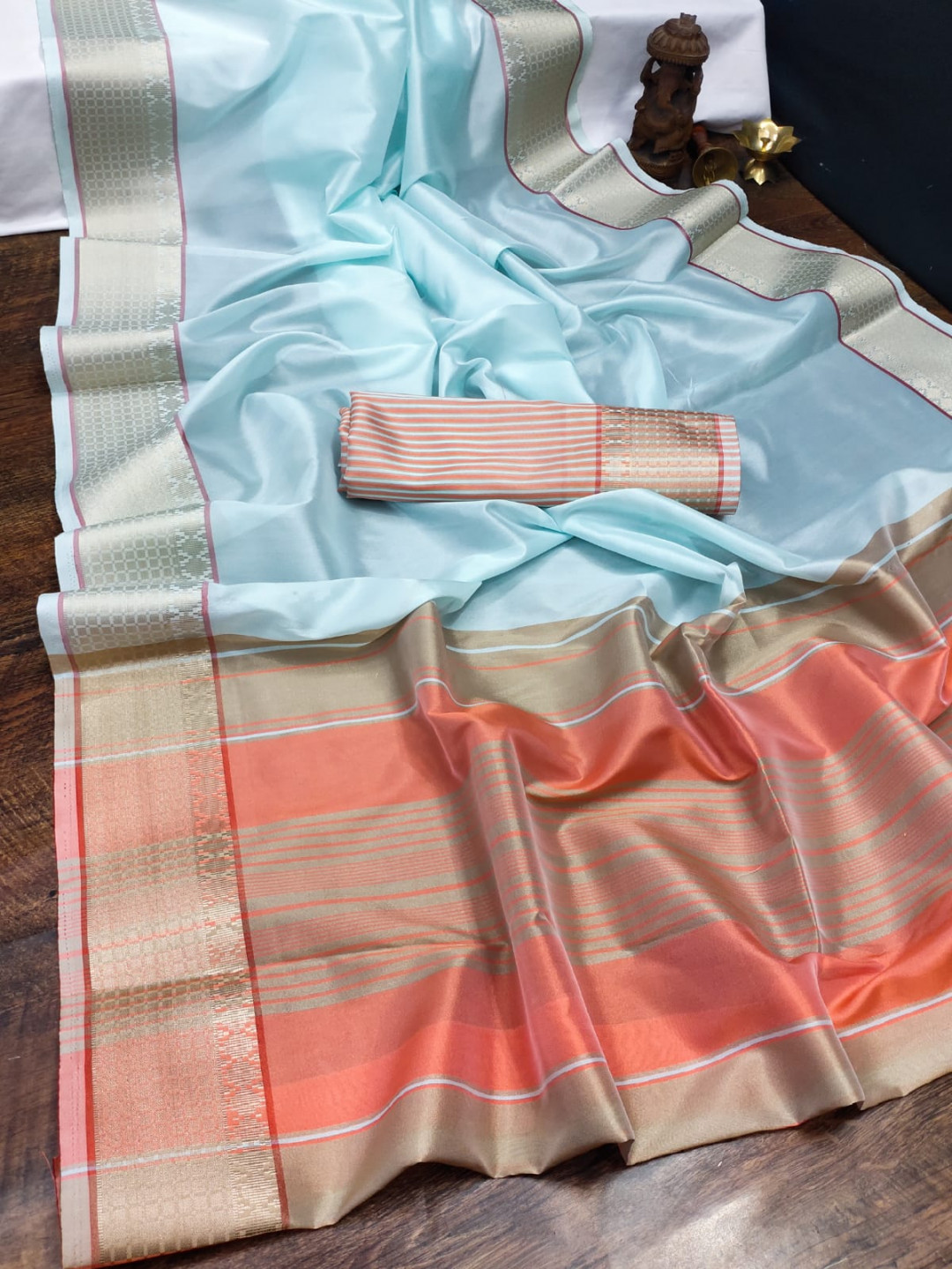 Sea green color organza silk saree with woven work