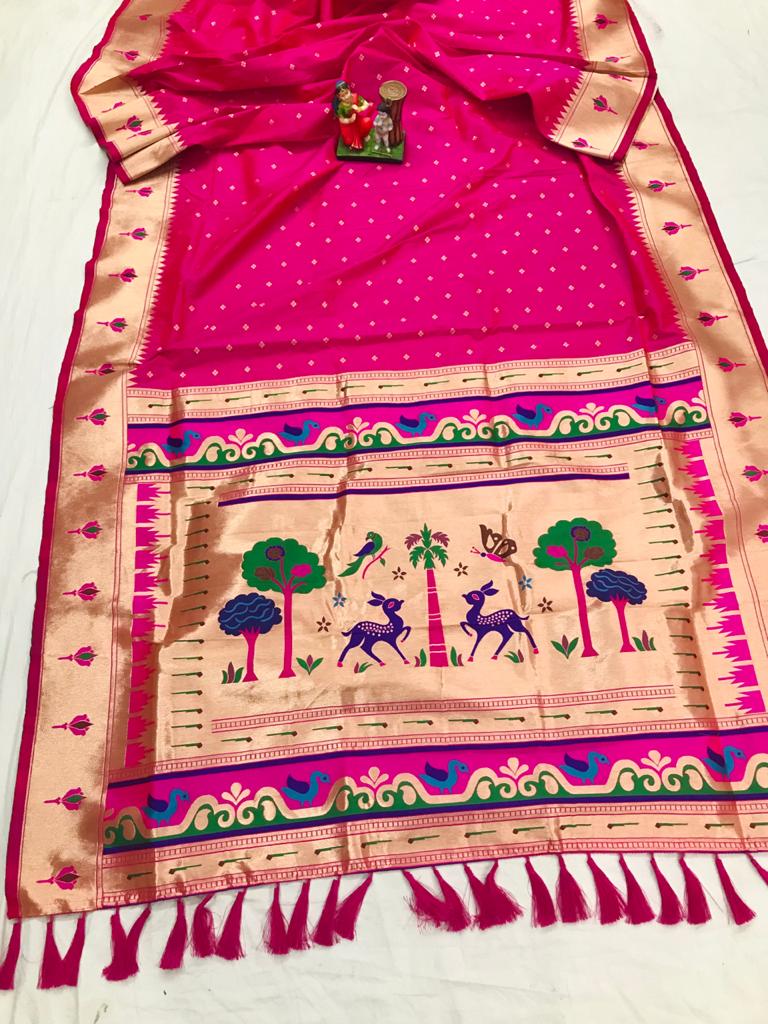 Rani pink color paithani silk saree with golden zari weaving work