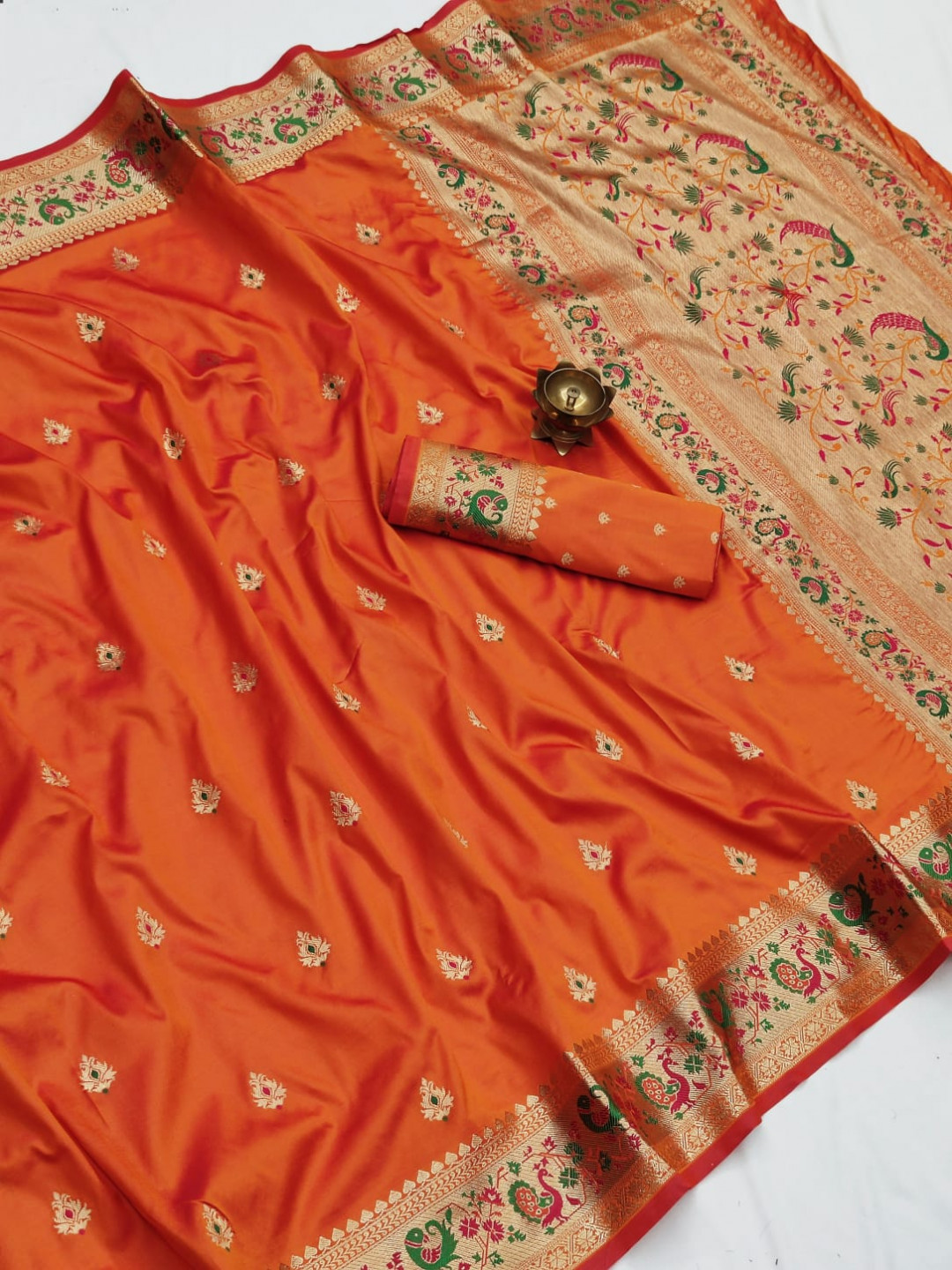 Orange color paithani silk saree with zari weaving work