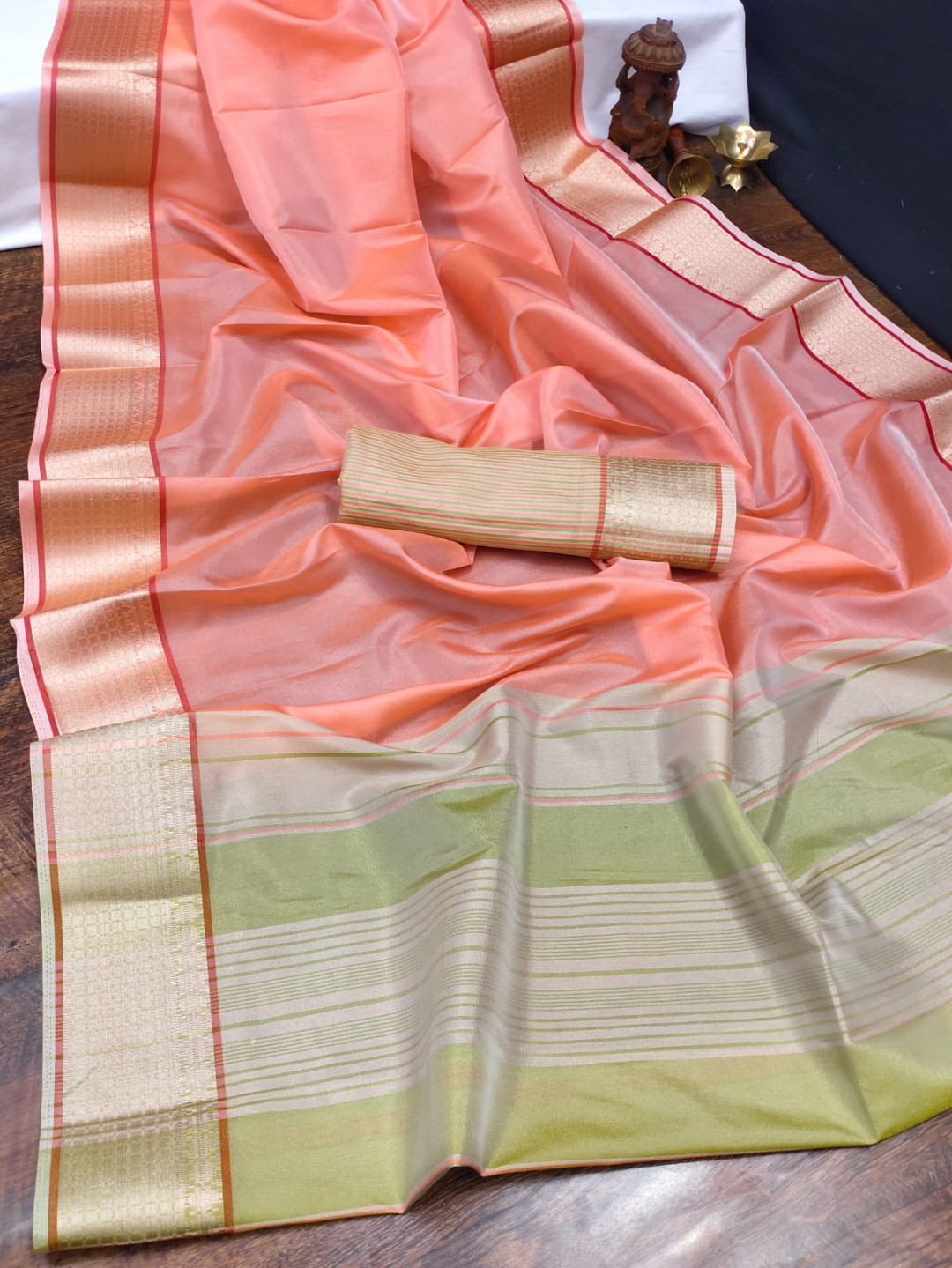 Peach color organza silk saree with woven work