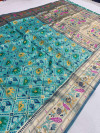 Sea green color patola silk saree with zari weaving work