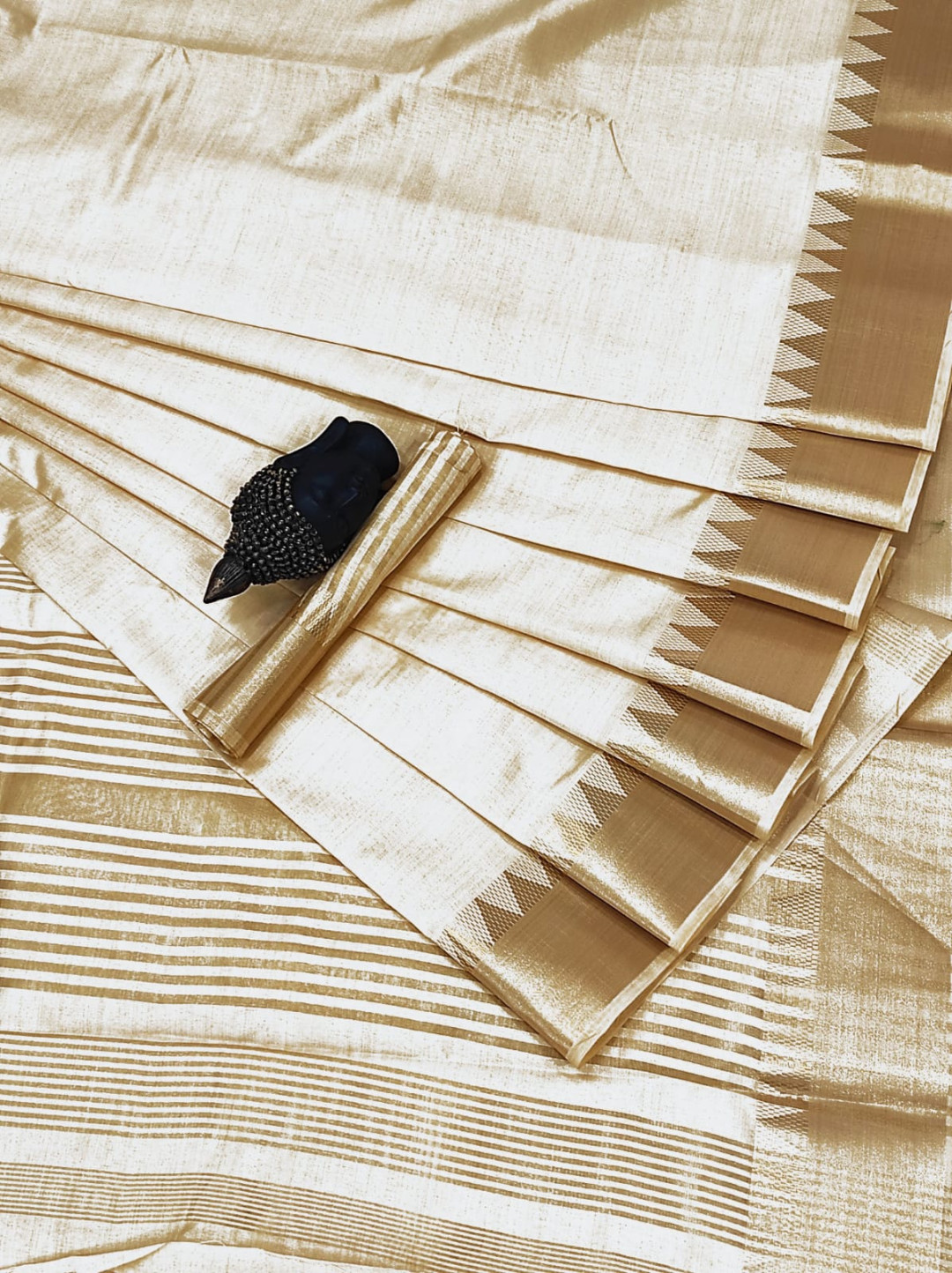 Off white color soft assam silk saree with golden zari weaving work