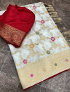 Off white color dola silk saree with zari weaving work