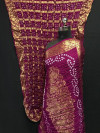 Magenta color pure hand bandhej silk saree with zari weaving work