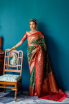 Green color patola silk saree with zari weaving work