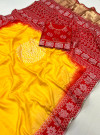 Yellow color cotton silk saree with bandhani printed work