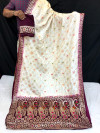 Off white color dola silk saree with zari woven work