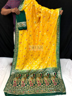 Yellow color dola silk saree with zari woven work