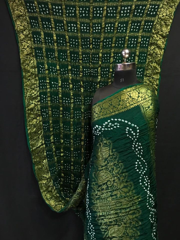 Bottle green color pure hand bandhej silk saree with zari weaving work