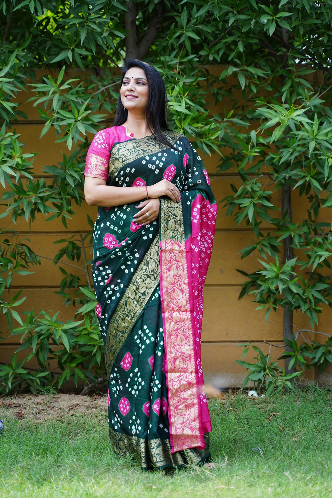 Bottle green color hand bandhej silk saree with bandhani printed work