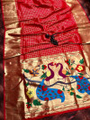 Red color paithani silk saree with attractive pallu
