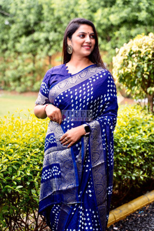 Mirraw - Style your love for ethnic wear with this heavy border Bandhani  saree. The blue color adds a stunning flair to the Bandhej print of the  saree and gives you the