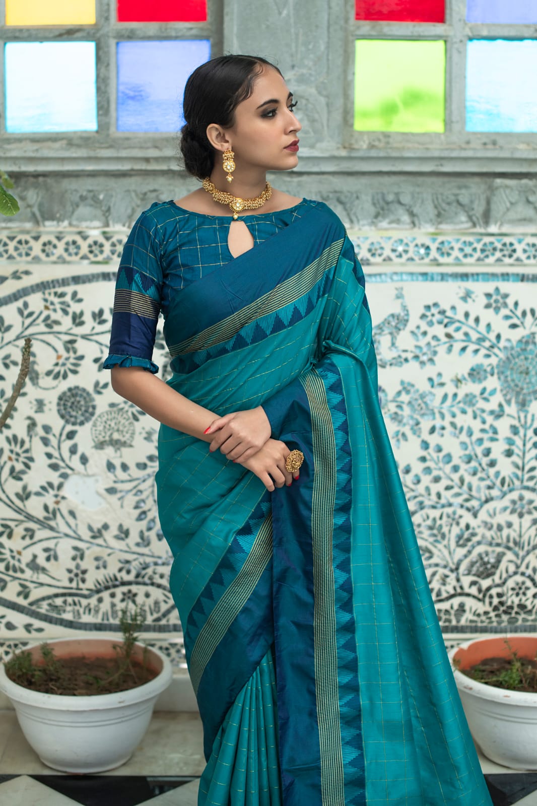 Rama green color soft raw silk saree with zari woven work