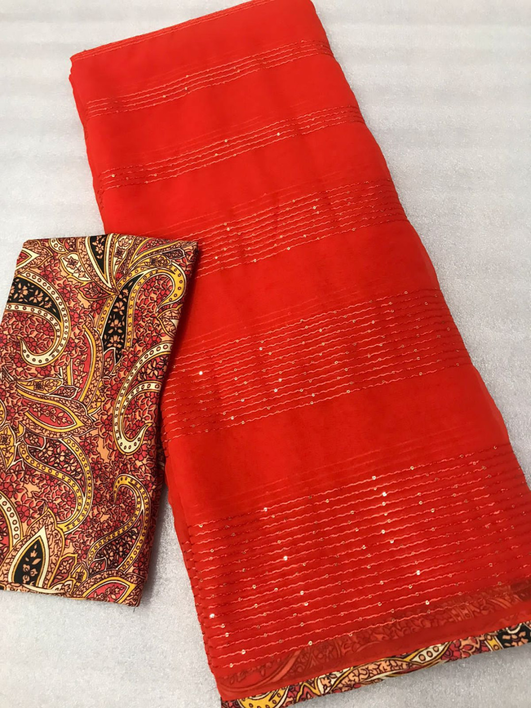 Orange color georgette saree with sequence work