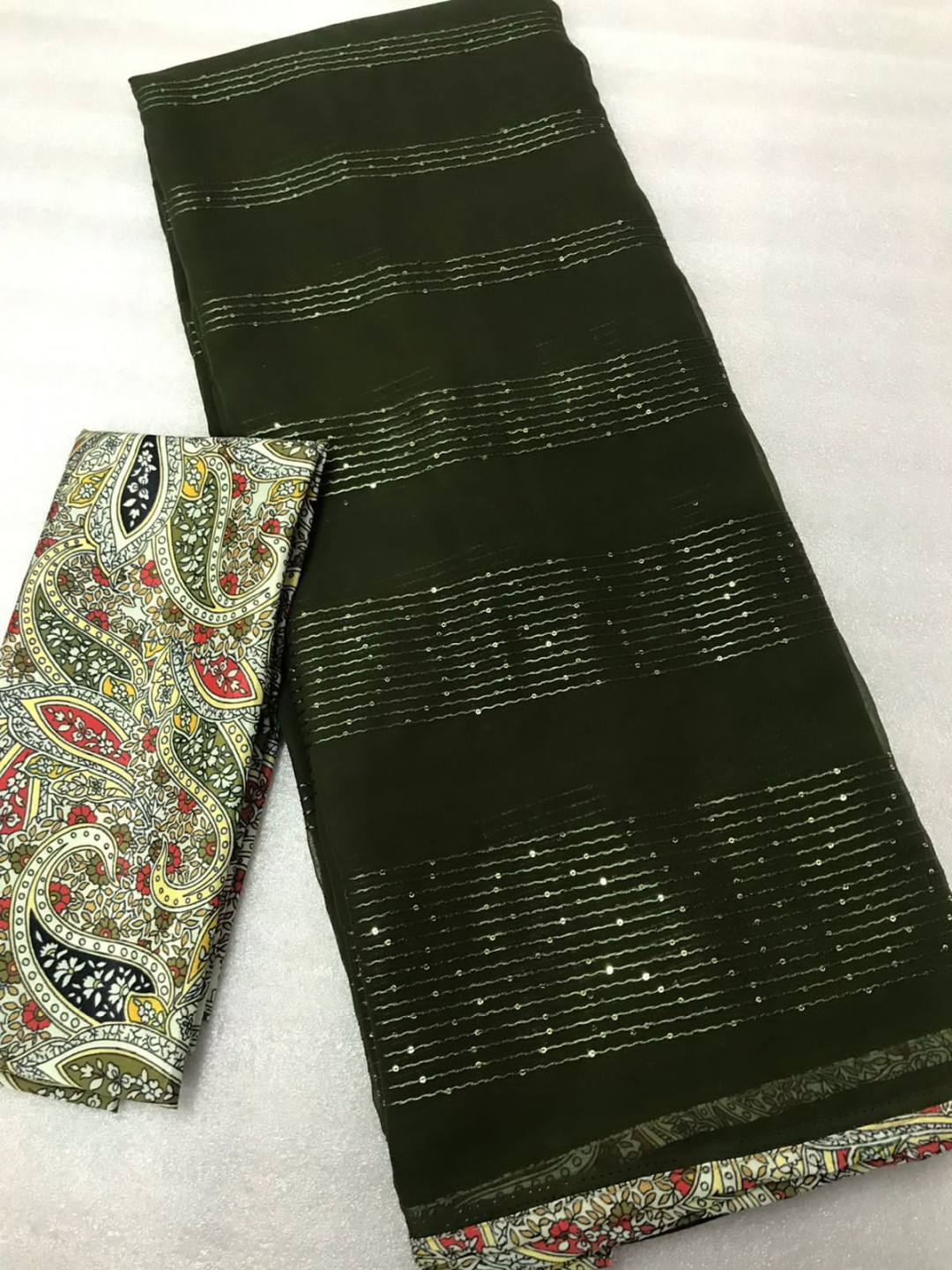Dark mahendi green color georgette saree with sequence work