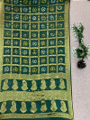 Dark green color hand bandhej silk saree with zari weaving work