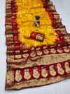 Yellow and maroon color hand bandhej silk saree with zari weaving work
