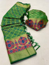 Green color patola silk saree with meenakari work