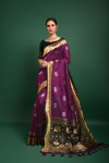 Magenta color tussar silk saree with zari woven border