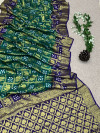 Dark green and purple color bandhej silk saree with zari weaving work