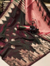 Dark green color ikkat silk saree with weaving work