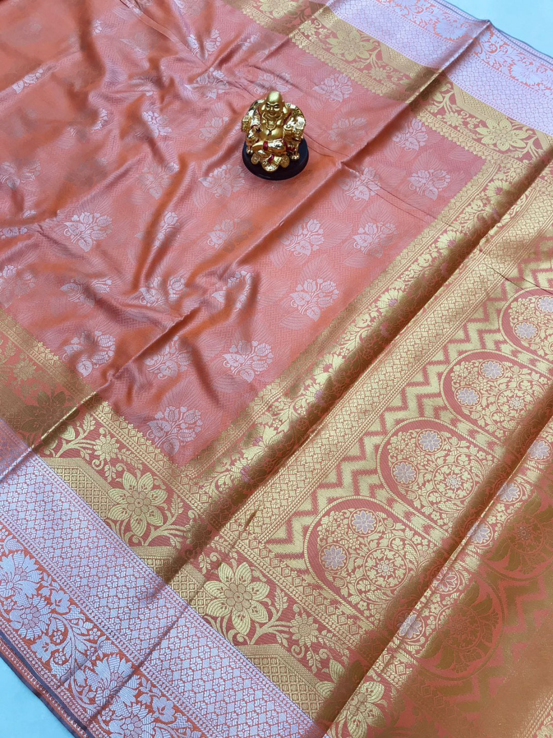Peach color kanchipuram silk saree with zari weaving work
