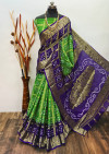 Parrot green and purple color hand bandhej silk saree with zari weaving work