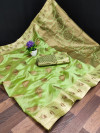 Pista green color organza silk saree with zari weaving work