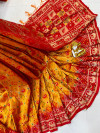 Red and orange color patola silk saree with golden zari weaving work