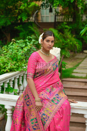 Rani pink color banarasi silk saree with zari weaving work