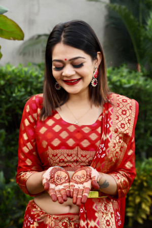 Maroon and green color bandhej silk saree with zari weaving work