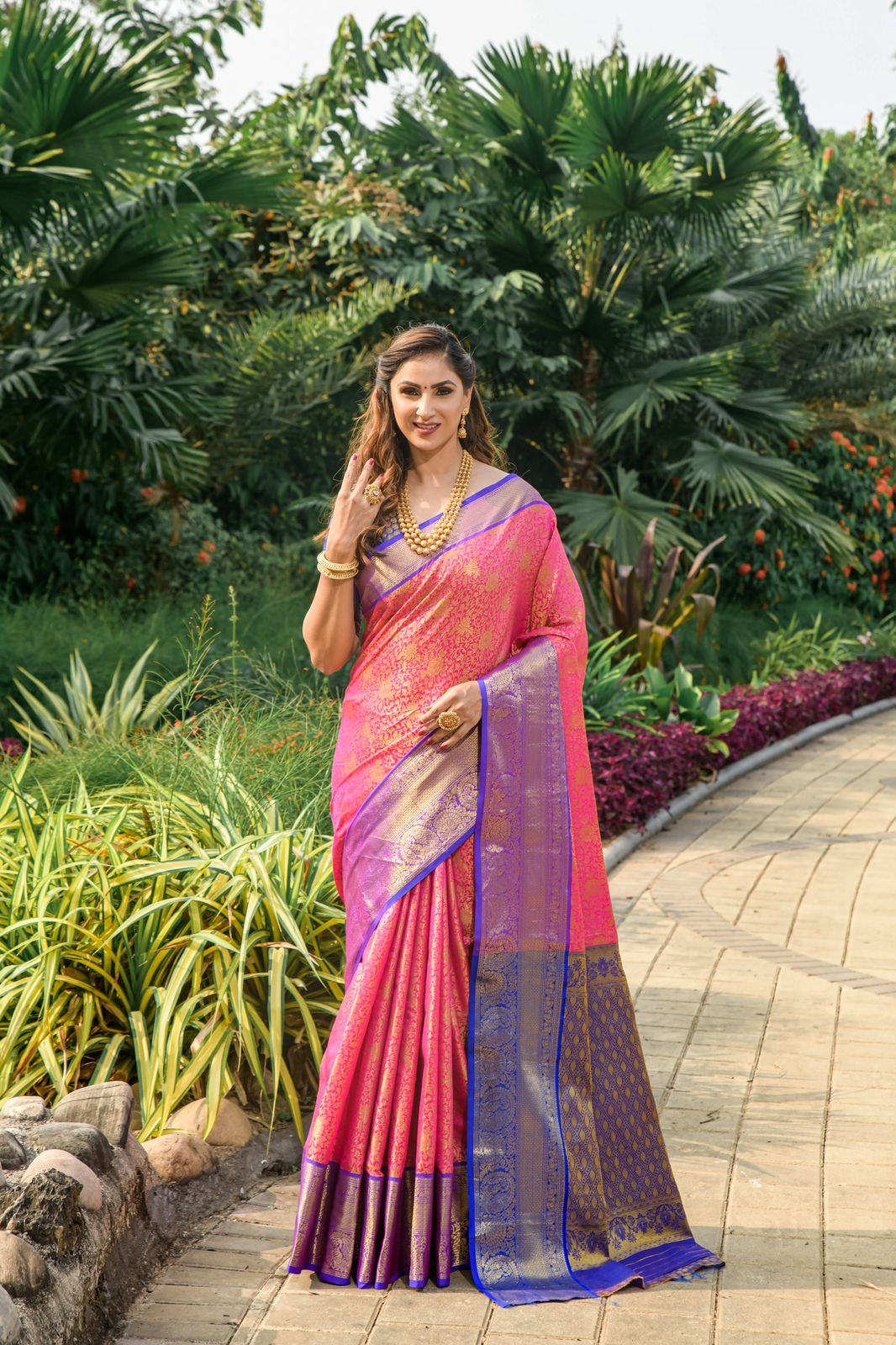 Rani pink color kanchipuram silk saree with zari weaving work